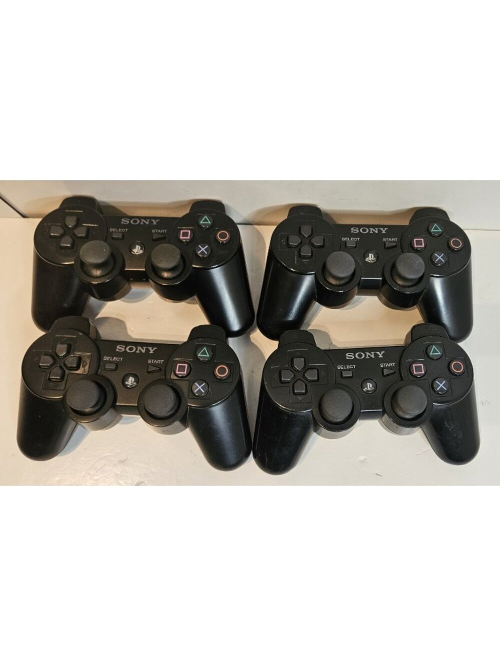 4 Sony PlayStation 3 (PS3) DualShock Controllers FOR PARTS OR REPAIR